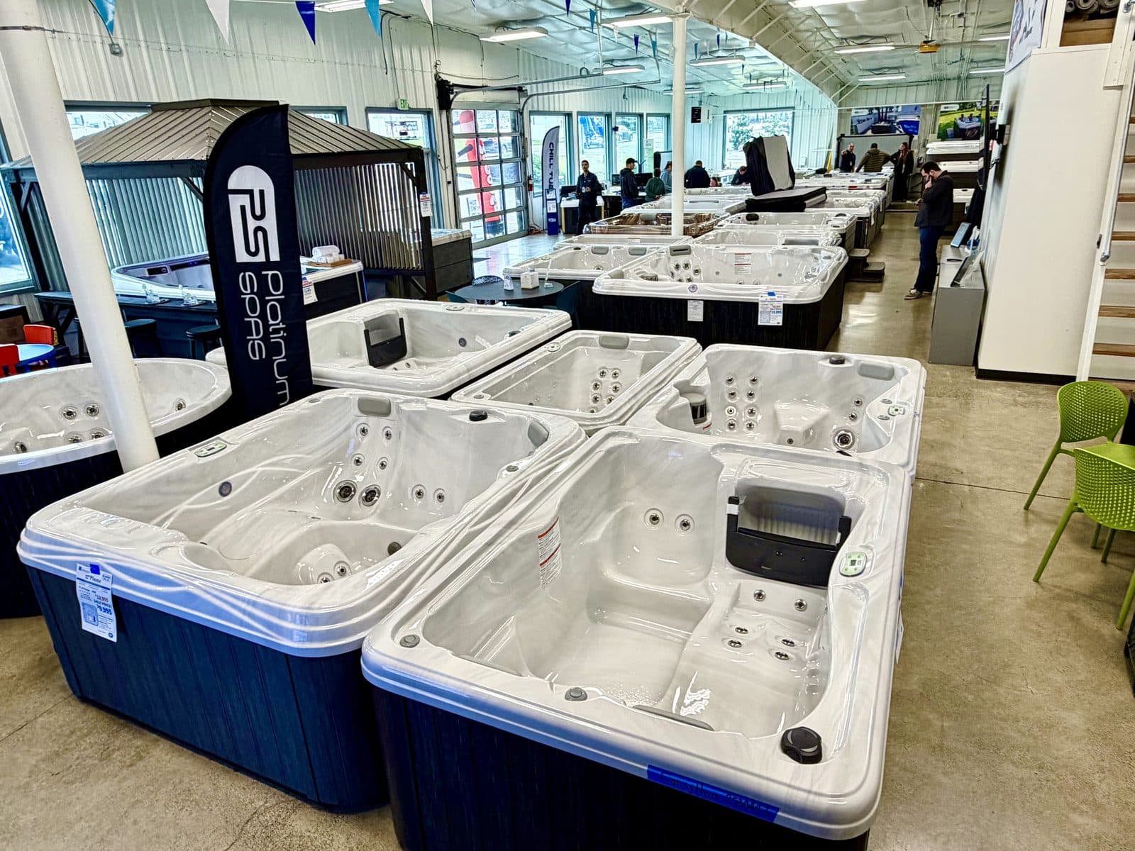 Black Pine showroom floor with filled hot tubs and swim spas