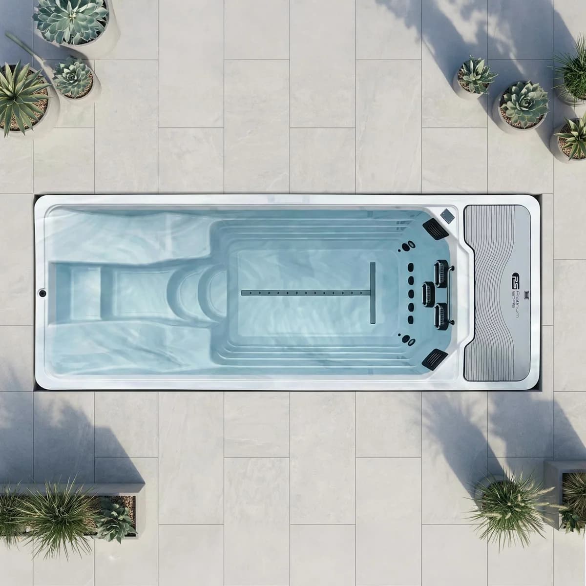 Overhead view of a Platinum Spas Artemis mini pool with its built-in seat and steps, shown lying sideways