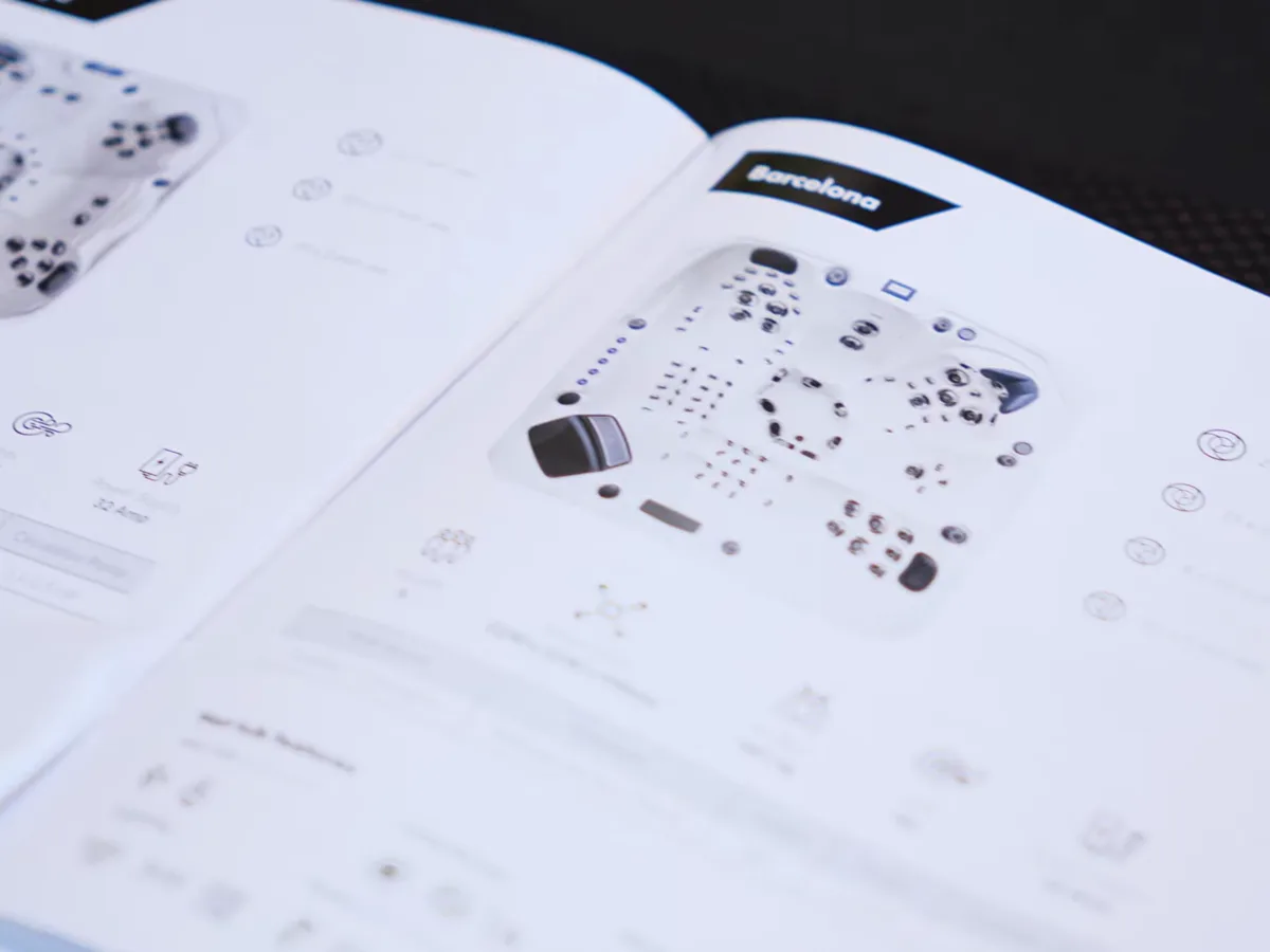 An open Platinum Spas owner's manual showing a hot tub layout diagram